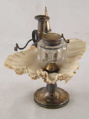 Appraisal: A Georgian silver inkwell formed of a clam shell supported