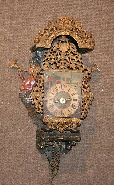 Appraisal: A Dutch polychrome decorated repousse metal and wood wall clock