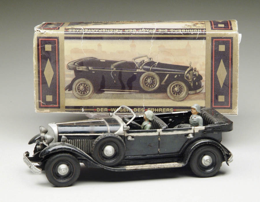 Appraisal: TIPPCO FUHRER CAR WITH DRIVER A black lithographed staff car