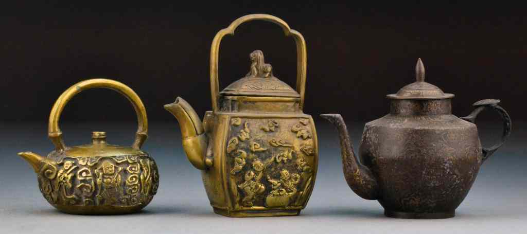 Appraisal: Chinese Qing Bronze TeapotsTwo depicting figures one depicting symbols and