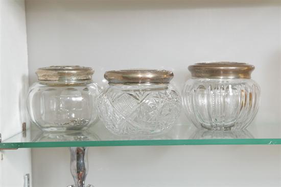 Appraisal: THREE GLASS DRESSER JARS WITH STERLING SILVER LIDS Two having