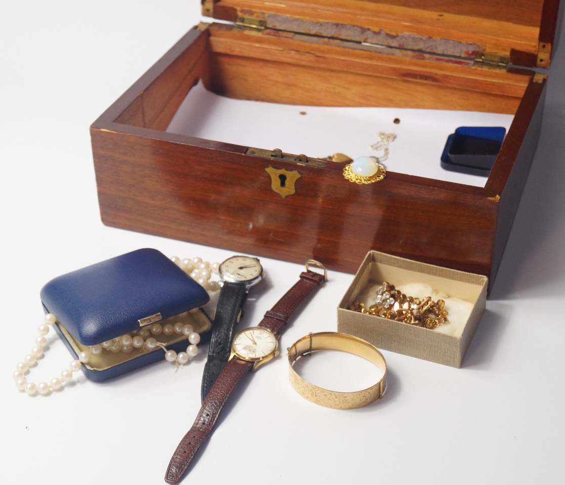 Appraisal: A Victorian mahogany box containing costume jewellery and watches including