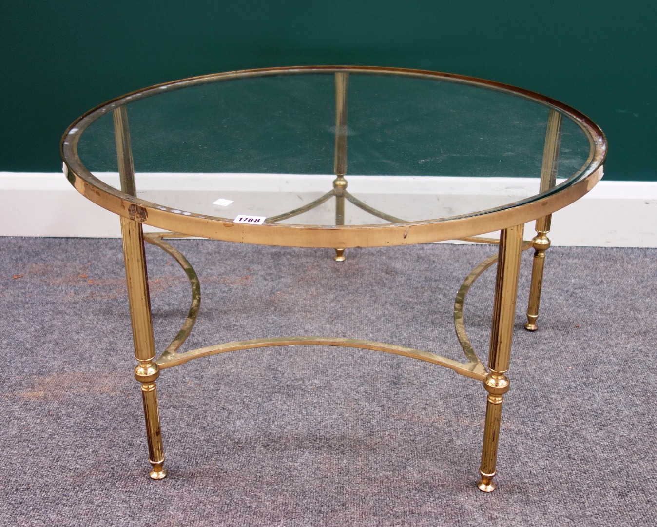 Appraisal: A th century circular lacquered brass coffee table on reeded