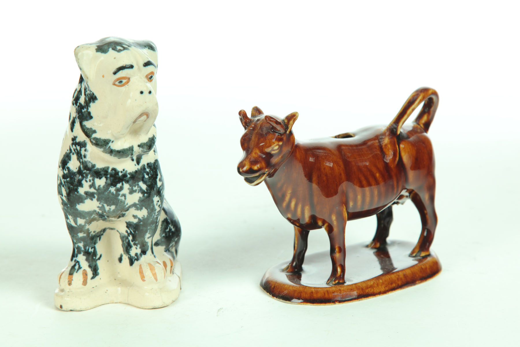 Appraisal: COW CREAMER AND DOG Ohio late th century white clay