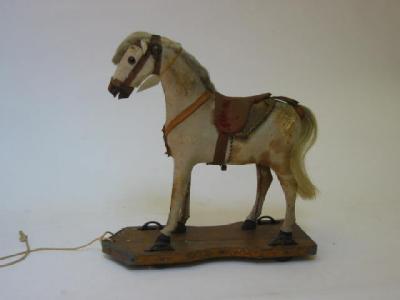 Appraisal: A pull-along horse late th early th century carved wood