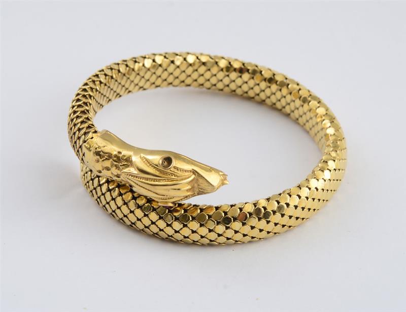 Appraisal: K GOLD SNAKE BANGLE Scale-like mesh coiled with interior spring