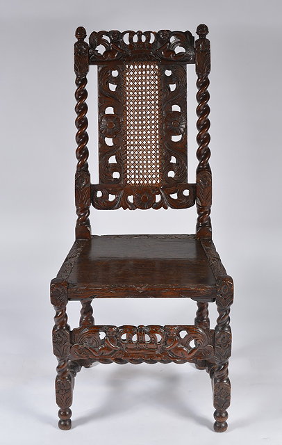 Appraisal: A late th Century walnut high back hall chairwith carved