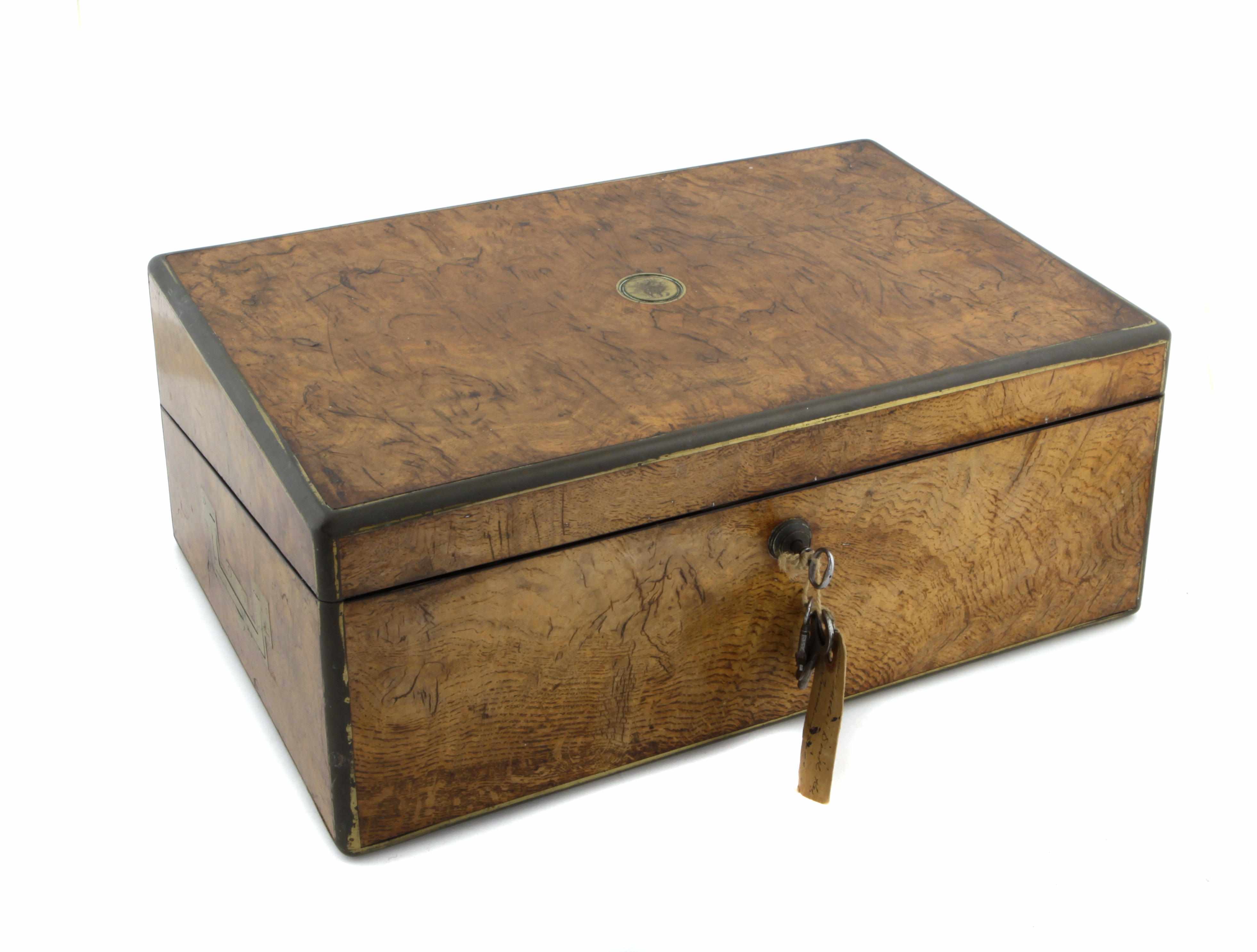 Appraisal: A George IV brass mounted pollard oak slant front lap