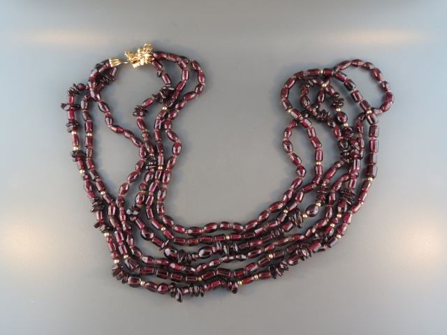 Appraisal: k Gold and Garnet Necklace figural yellow gold dragon clasp