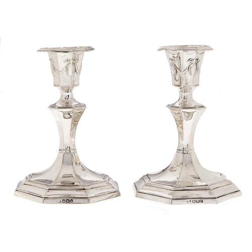 Appraisal: A pair of Victorian silver dwarf octagonal candlesticks nozzles cm