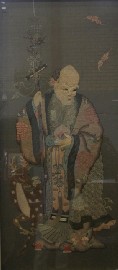 Appraisal: Two Chinese framed textiles one depicting a Jurojin man the