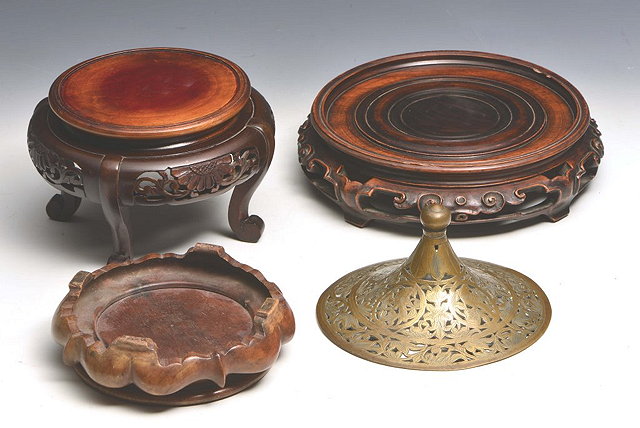 Appraisal: A CHINESE HARDWOOD CIRCULAR CARVED STAND with pierced and scroll