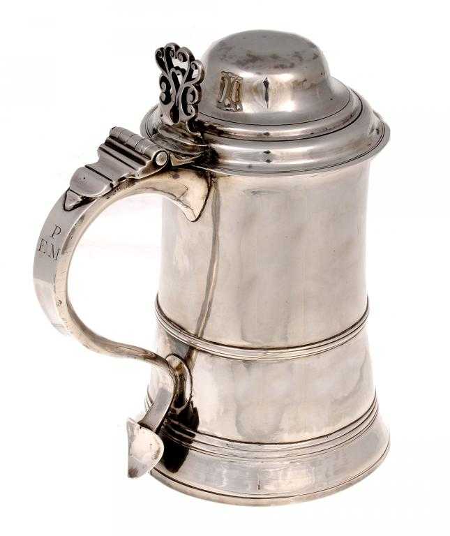 Appraisal: A GEORGE III TANKARD the ogee domed lid with scroll