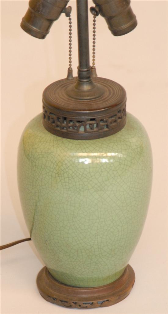 Appraisal: ORIENTAL JAR AS A LAMP Green crackle glazed with openwork