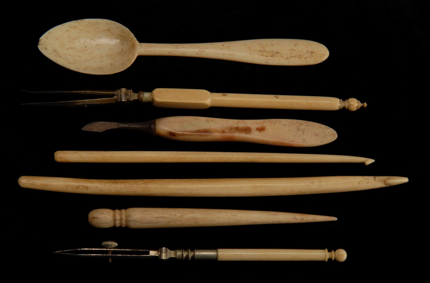 Appraisal: SEVEN WHALEBONE AND IVORY ITEMS a child's spoon with Eliza