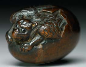 Appraisal: ANTIQUE WOOD NETSUKE Antique and well carved wood netsuke of