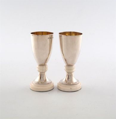 Appraisal: A pair of Art Deco small silver and ivory goblets