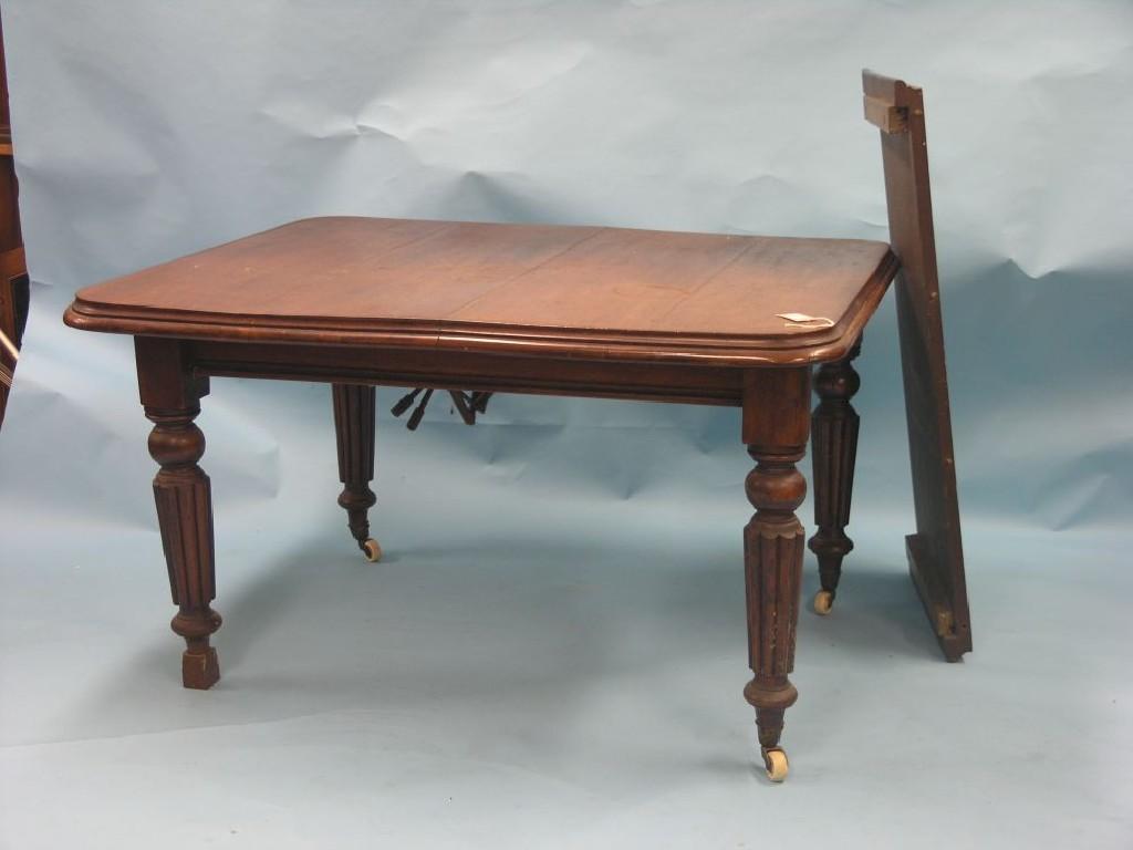 Appraisal: A Victorian mahogany wind-action dining table with extra leaf on