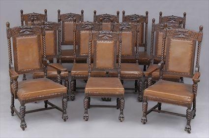 Appraisal: SET OF TWELVE JACOBEAN-STYLE CARVED OAK DINING CHAIRS Including armchairs