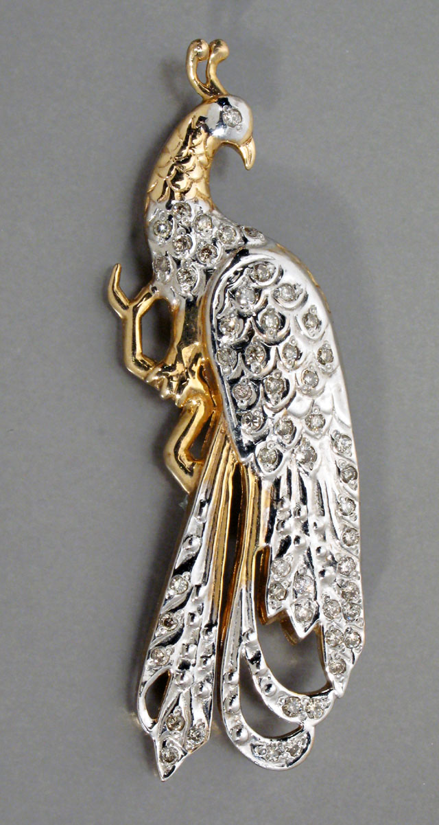 Appraisal: DIAMOND AND TWELVE KARAT GOLD PEACOCK BROOCH the yellow gold