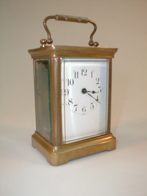 Appraisal: A French brass carriage clock with enamel style dial