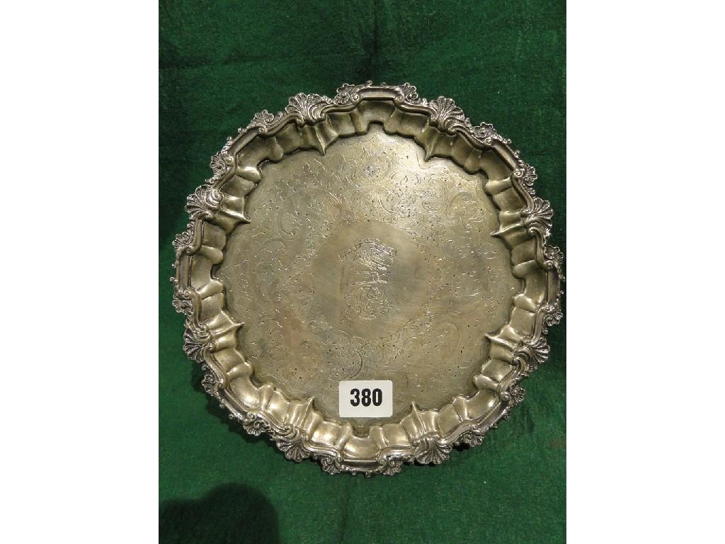 Appraisal: A Victorian silver salver with scrolled and scalloped edge bearing