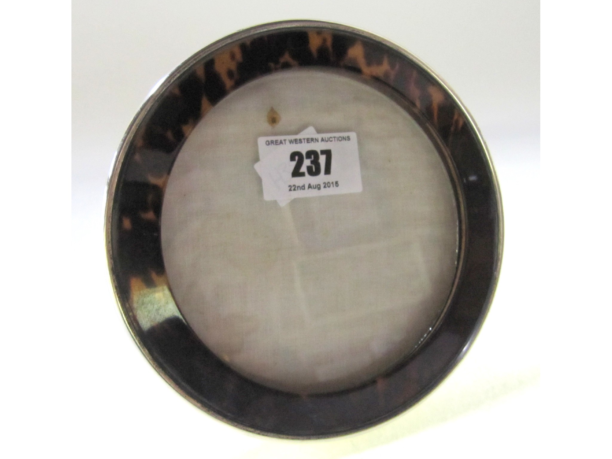 Appraisal: A circular silver mounted and tortoiseshell photo frame Birmingham