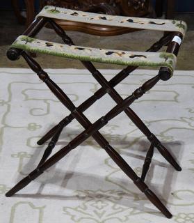 Appraisal: American mahogany folding luggage rack with needlepoint straps depicting hunting