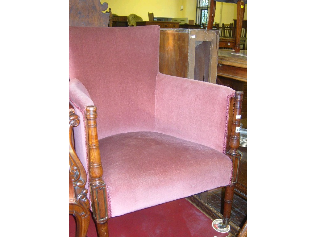 Appraisal: A Georgian armchair with upholstered seat and back raised on