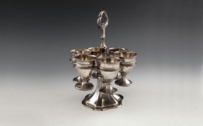 Appraisal: A Victorian silver egg cup frame with six egg cups