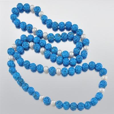 Appraisal: A Carved Turquoise Bead and Pearl Necklace An elegant carved