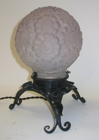 Appraisal: A FRENCH TABLE LAMP The hand crafted metal base on