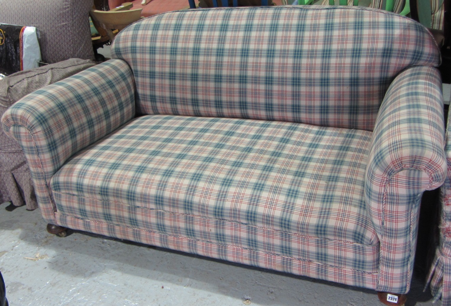 Appraisal: A two seat sofa and armchair with tartan upholstery