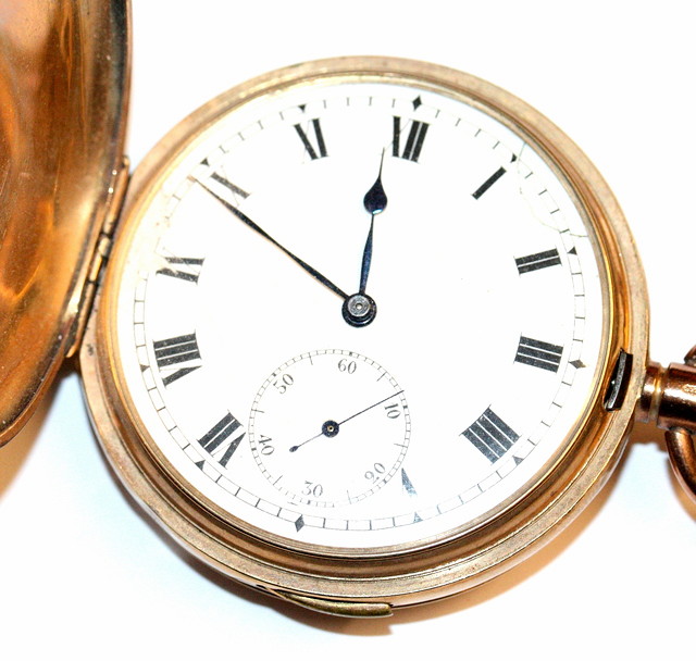 Appraisal: A CT GOLD HUNTER POCKET WATCH with a white enamel