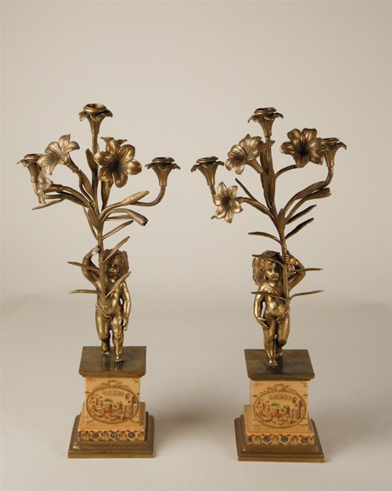 Appraisal: A Pair of Bronze Brass and Porcelain Candelabras triple branch