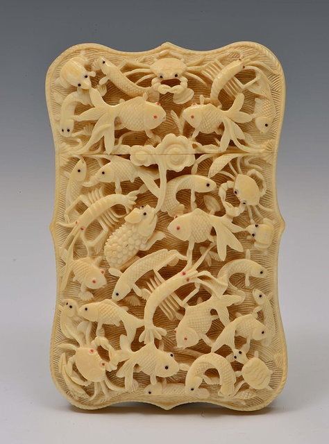 Appraisal: A CHINESE CANTON IVORY CARD CASE carved and undercut with