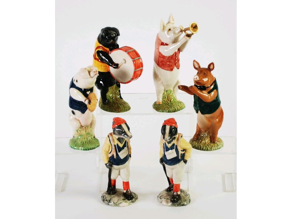 Appraisal: A COLLECTION OF FOUR BESWICK POTTERY PIGS all playing musical