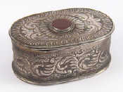 Appraisal: An embossed oval box with cornelian stone on hinged lid