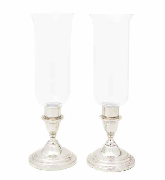 Appraisal: A Pair Silverplate Candle Sticks of squat baluster form with