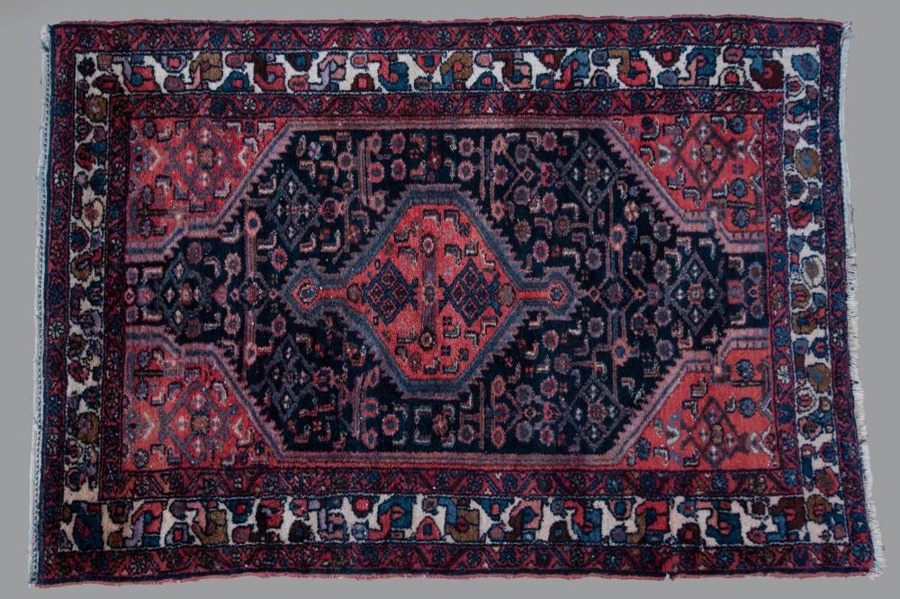 Appraisal: PERSIAN HAMADAN HAND KNOTTED WOOL RUG tribal design with a