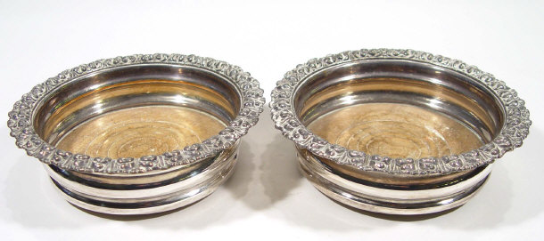 Appraisal: Pair of silver plated wine coasters cm diameter