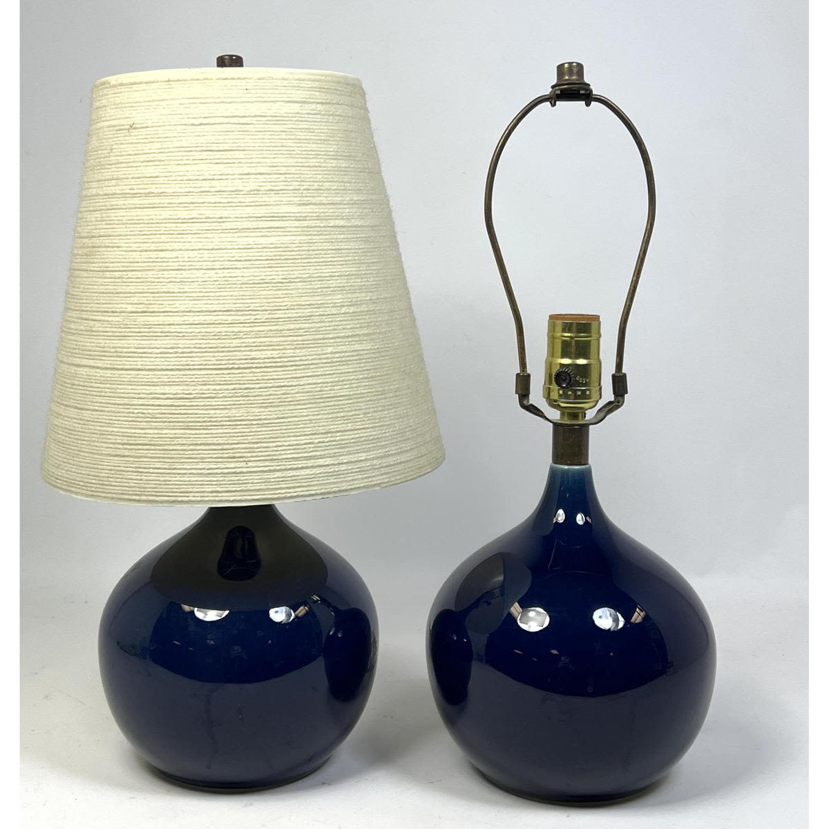 Appraisal: Pair Blue Glaze Bostlund Lamps One original shade Dimensions H