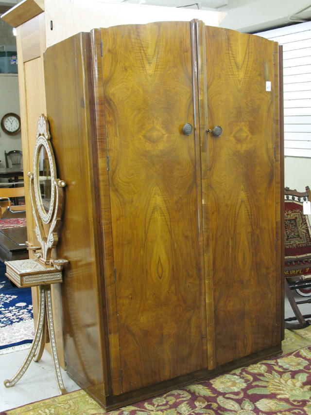 Appraisal: WALNUT DOUBLE-DOOR WARDROBE English mid- th century the doors opening