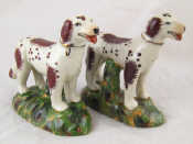 Appraisal: A pair of Staffordshire dogs with spotted and patch brown