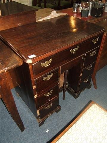 Appraisal: A Georgian mahogany kneehole desk with an arrangement of drawers