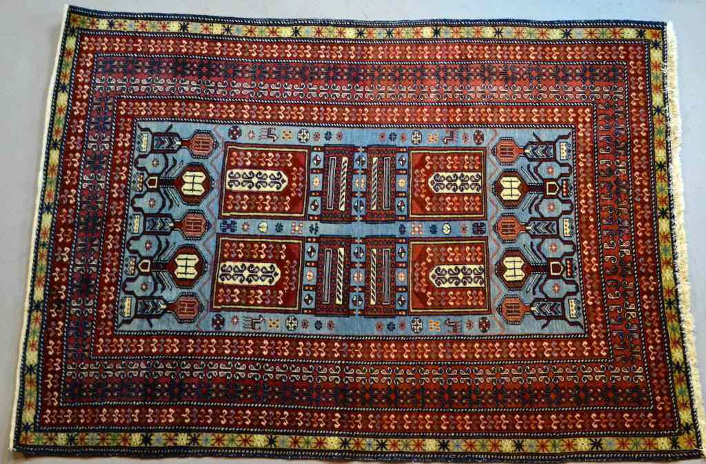 Appraisal: Persian Wool RugDeep red dark light blue with blue center