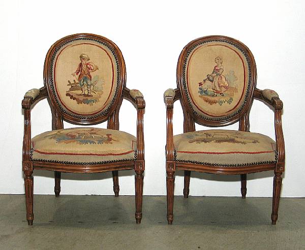 Appraisal: A pair of Louis XVI style beechwood fauteuils late th