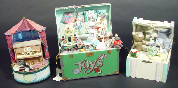 Appraisal: Three musical boxes two modelled as toy boxes and one