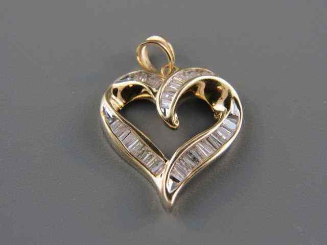 Appraisal: Diamond Heart Pendant baguette diamonds totaling carat in k yellow