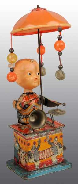 Appraisal: Tin Celluloid Musical Wind-Up Toy Description Japanese Pre-war Working Tin